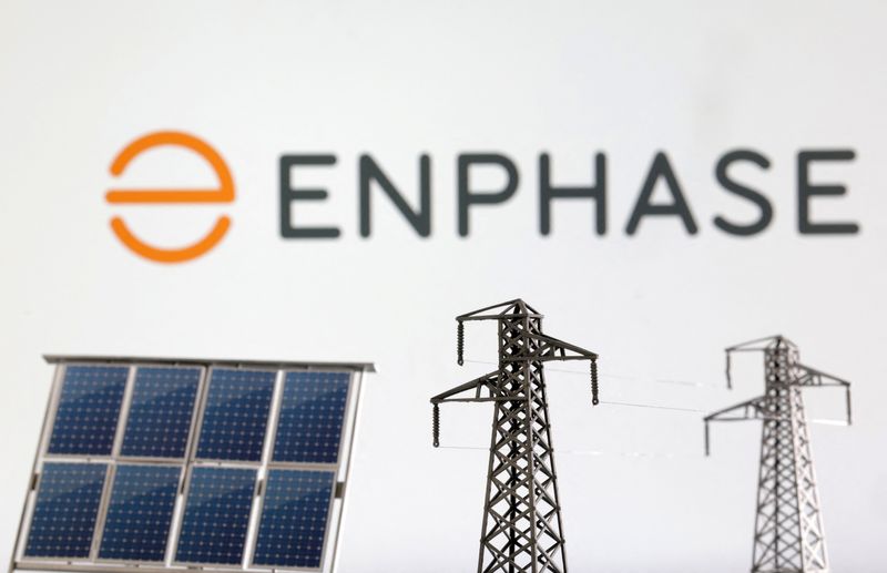 &copy; Reuters. Miniatures of solar panel and electric pole are seen in front of Enphase logo in this illustration taken January 17, 2023. REUTERS/Dado Ruvic/Illustration