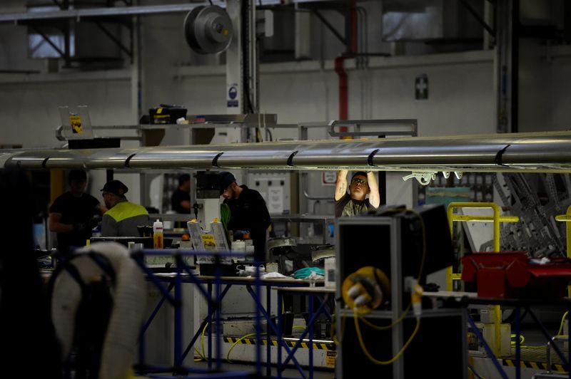 &copy; Reuters. FILE PHOTO: A man works on C Series aeroplane wing in the Bombardier factory in Belfast, Northern Ireland September 26, 2017. REUTERS/Clodagh Kilcoyne/File Photo