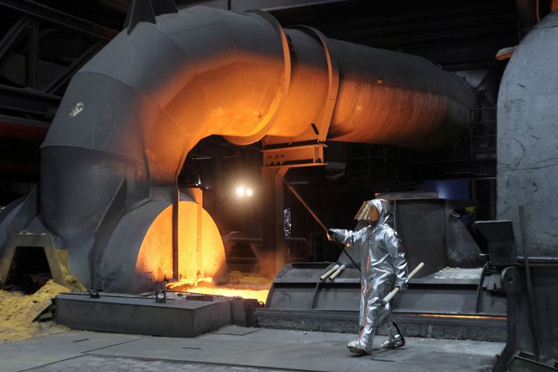 &copy; Reuters. FILE PHOTO: A steel worker of ThyssenKrupp walks in front of a blast furnace at a ThyssenKrupp steel factory in Duisburg, western Germany, November 14, 2022. REUTERS/Wolfgang Rattay/File Photo