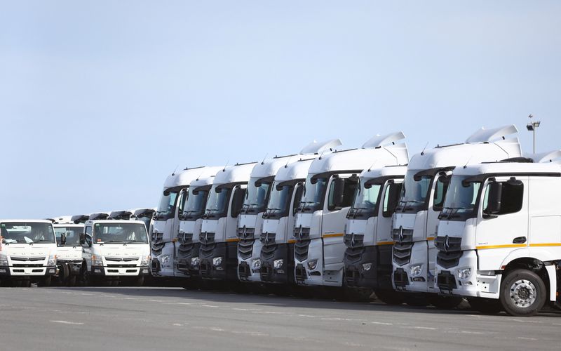 &copy; Reuters. FILE PHOTO: Newly manufactured trucks from a nearby plant are parked before being loaded onto a cargo ship at a port, in East London, in the Eastern Cape province, South Africa, March 19, 2023. REUTERS/Siphiwe Sibeko