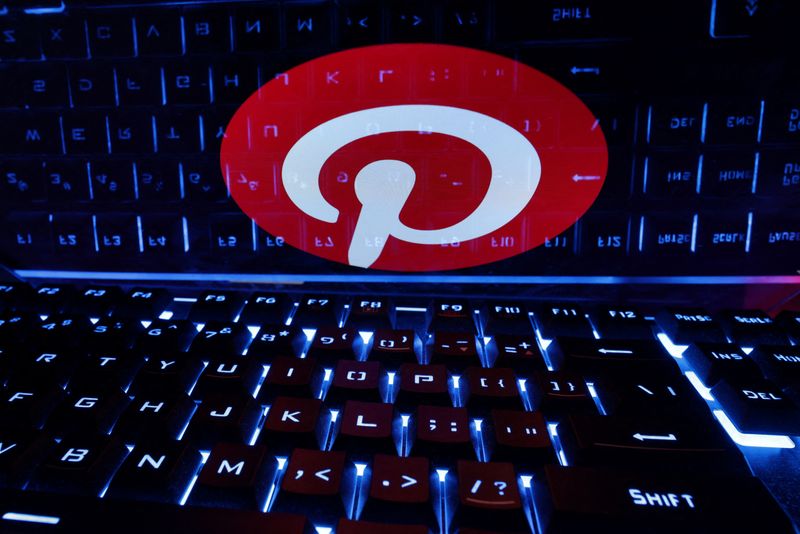 &copy; Reuters. A keyboard is placed in front of a displayed Pinterest logo in this illustration taken February 21, 2023. REUTERS/Dado Ruvic/Illustration