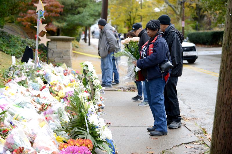 &copy; Reuters. FILE PHOTO: People gather at a makeshift memorial a block from the scene of last Saturday's shooting at the Tree of Life synagogue, in Pittsburgh, Pennsylvania, U.S., November 3, 2018.  REUTERS/Alan Freed/File Photo