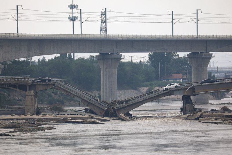 &copy; Reuters. A bridge is damaged after remnants of Typhoon Doksuri brought rains and floods in Beijing, China August 2, 2023. REUTERS/Tingshu Wang
