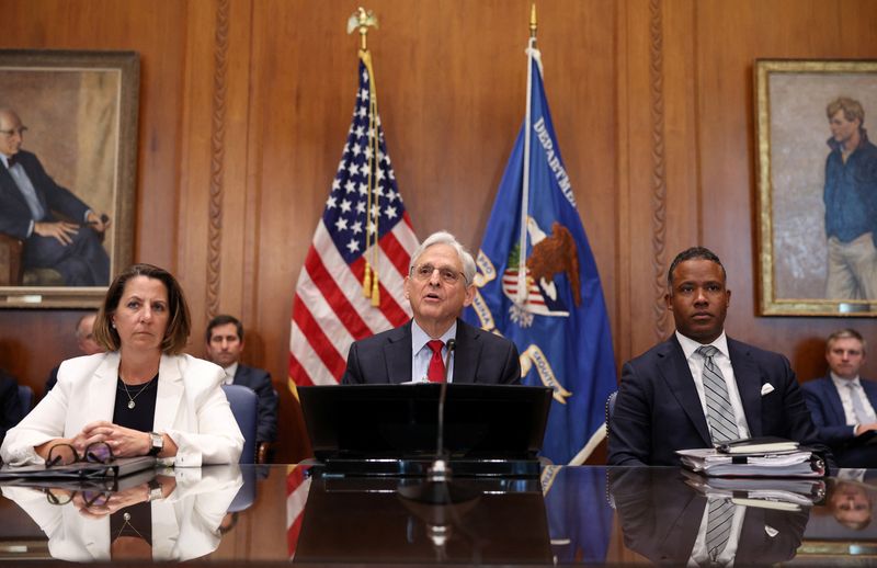 &copy; Reuters. U.S. Attorney General Merrick Garland is flanked by Deputy Attorney General Lisa O. Monaco and Assistant Attorney General Kenneth Polite of the Justice Department's Criminal Division as he meets with his deputies and U.S. attorneys from across the country