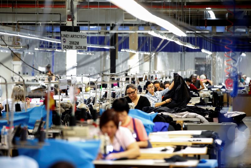 &copy; Reuters. FILE PHOTO: Workers make jackets at the Canada Goose factory in Toronto, Ontario, Canada, February 23, 2018. REUTERS/Mark Blinch/File Photo