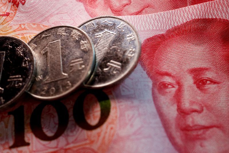 &copy; Reuters. FILE PHOTO: Coins and banknotes of China's yuan are seen in this illustration picture taken February 24, 2022. REUTERS/Florence Lo/Illustration/File Photo/File Photo