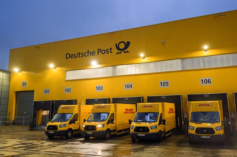 &copy; Reuters. Delivery cars are lined up at a distribution centre of German postal and logistics group Deutsche Post DHL in Hamburg, Germany, December 8, 2022. REUTERS/Fabian Bimmer/File Photo