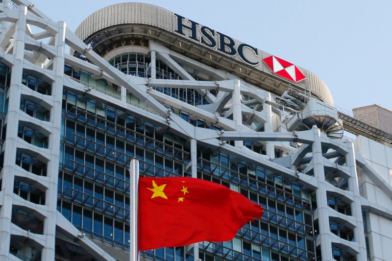 &copy; Reuters. FILE PHOTO: A Chinese national flag flies in front of HSBC headquarters in Hong Kong, China, July 28, 2020. REUTERS/Tyrone Siu/File Photo