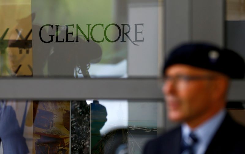 &copy; Reuters. FILE PHOTO: An employee of a private security company stands in front of the logo of commodities trader Glencore during the company's annual shareholder meeting in Cham, Switzerland May 24, 2017. REUTERS/Arnd Wiegmann/File Photo
