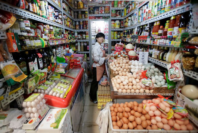 &copy; Reuters. FILE PHOTO: A vendor is seen in her store at a supermarket in downtown Beijing, China, May 23, 2019. REUTERS/Jason Lee