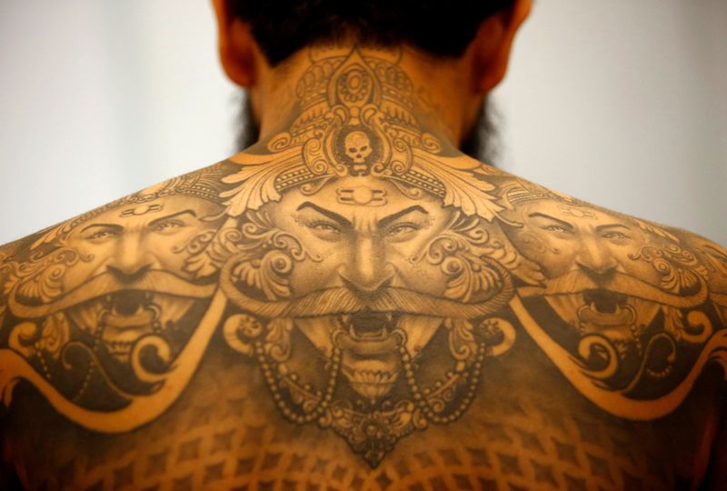 © Reuters. FILE PHOTO: A tattoo of Hindu demon Ravan is pictured on a back of a man during the Nepal Tattoo Convention in Kathmandu, Nepal April 2, 2017. REUTERS/Navesh Chitrakar/File Photo