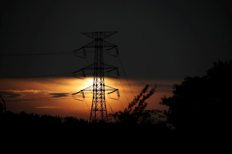 &copy; Reuters. FILE PHOTO: A transmission tower is silhouetted against the setting sun near Kori Nuclear Power Plant in Busan, South Korea, August 18, 2022.   REUTERS/Kim Hong-Ji