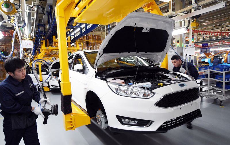 &copy; Reuters. FILE PHOTO: Workers assemble vehicles at a plant of Changan Ford, a joint venture between Changan Automobile and Ford Motor Company, in Harbin, Heilongjiang province, China February 22, 2017. REUTERS/Stringer/File Photo 