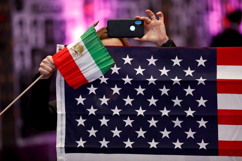 &copy; Reuters. Attendees hold flags from Iran and the United States as Iranian Americans from across California converge in Los Angeles, California, U.S., January 11, 2020. REUTERS/ Patrick T. Fallon/ File Photo
