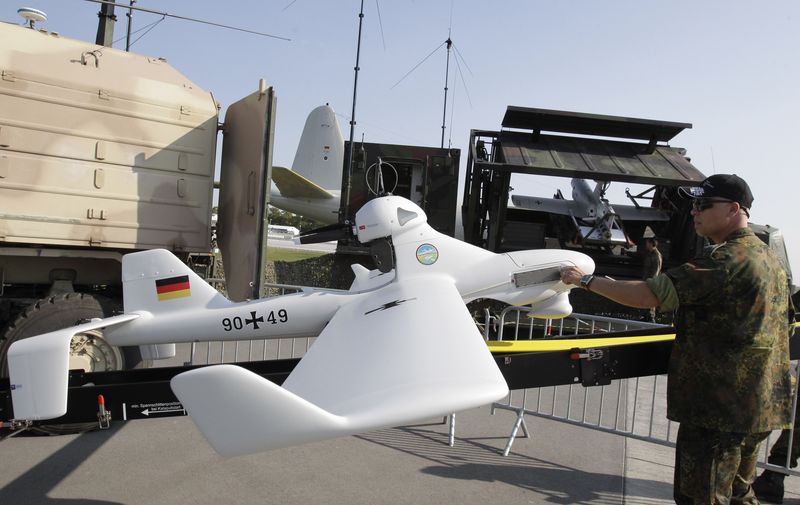 &copy; Reuters. FILE PHOTO: A soldier of German armed forces Bundeswehr puts final touch at a LUNA drone system at the ILA Berlin Air Show in Selchow near Schoenefeld south of Berlin, September 10, 2012. REUTERS/Tobias Schwarz/File Photo