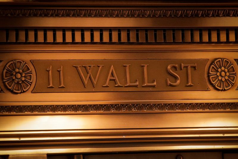 &copy; Reuters. FILE PHOTO: A sign is seen outside the 11 Wall St. entrance of the New York Stock Exchange (NYSE) in New York, U.S., March 1, 2021. REUTERS/Brendan McDermid/File Photo
