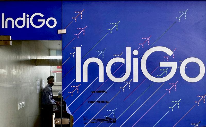 © Reuters. FILE PHOTO: A person is seen inside an IndiGo airlines ticketing office at Chhatrapati Shivaji International airport in Mumbai, India, May 30, 2023. REUTERS/Francis Mascarenhas/File Photo