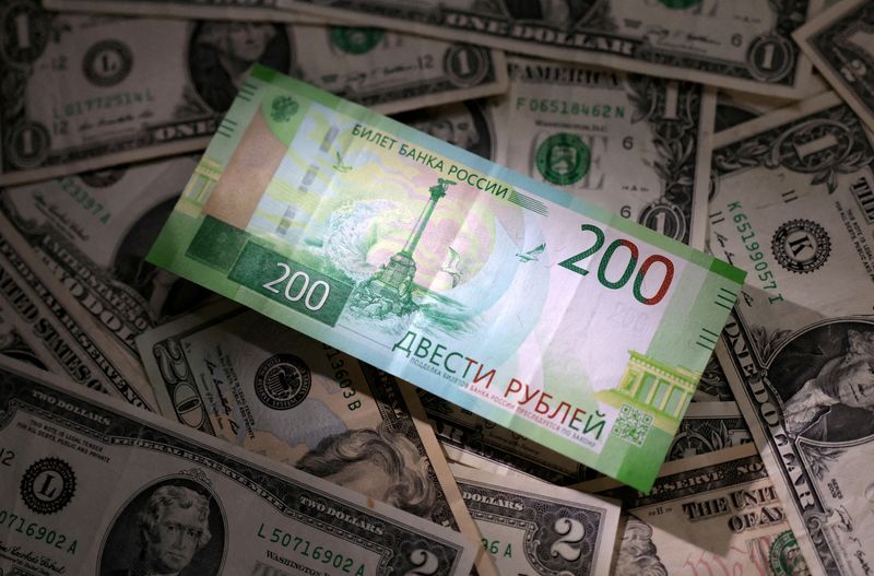 © Reuters. FILE PHOTO: Russian rouble and U.S. dollar banknotes are seen in this illustration photo taken March 10, 2023. REUTERS/Dado Ruvic/Illustration/File Photo