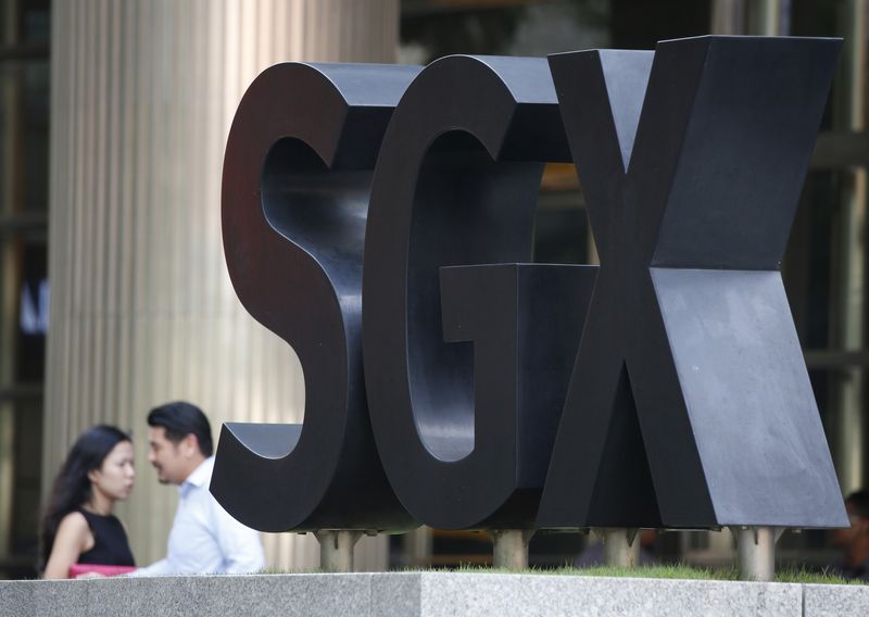 &copy; Reuters. FILE PHOTO: People pass an SGX Singapore Exchange logo outside its premises in Singapore's central business district January 7, 2016.  REUTERS/Edgar Su/File Photo