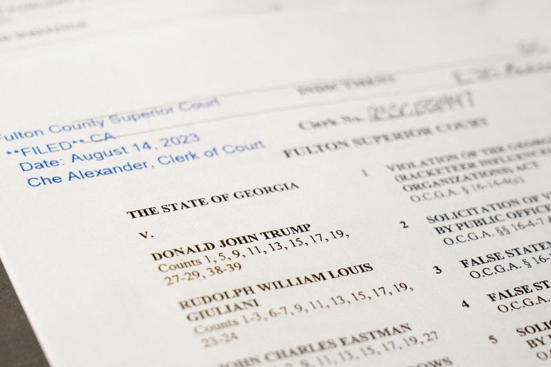 &copy; Reuters. A view of the indictment, after a Georgia grand jury voted to indict former president Donald Trump with several felonies late Monday night in the case investigating attempts to overturn the results of the 2020 presidential election, is pictured at the Reu