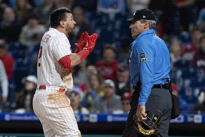 © Reuters. Apr 24, 2022; Philadelphia, Pennsylvania, USA; Philadelphia Phillies designated hitter Kyle Schwarber (12) argues with umpire Angel Hernandez after being called out on strikes during the ninth inning against the Milwaukee Brewers at Citizens Bank Park. / Bill Streicher-USA TODAY Sports/File Photo