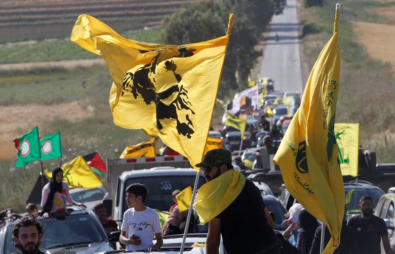 &copy; Reuters. Supporters of Lebanon's Hezbollah leader Sayyed Hassan Nasrallah ride in a convoy marking Resistance and Liberation Day, in Kfar Kila village, near the border with Israel, southern Lebanon, May 25, 2021. REUTERS/Aziz Taher/File Photo