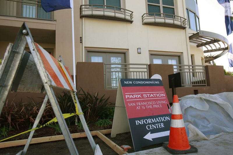&copy; Reuters. Construction equipment sits next to signs advertising new condominium homes for sale in South San Francisco, California, December 22, 2009.  REUTERS/Robert Galbraith/file photo