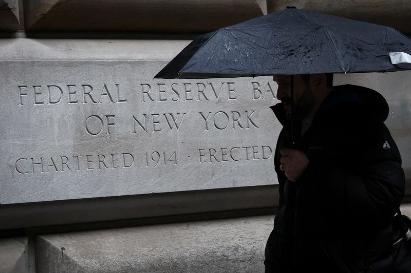 &copy; Reuters. A man passes by The Federal Reserve Bank of New York in New York City, U.S., March 13, 2023.  REUTERS/Brendan McDermid/File photo