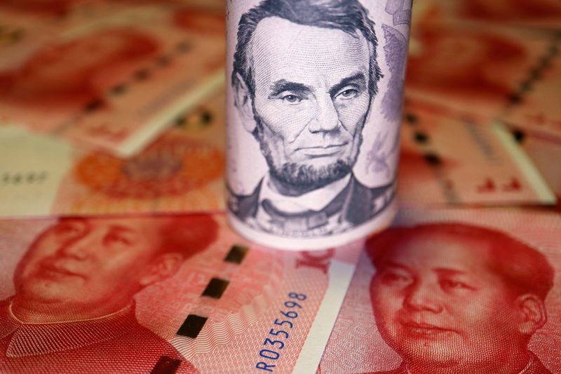 © Reuters. FILE PHOTO: U.S. Dollar and Chinese Yuan banknotes are seen in this illustration picture taken June 14, 2022. REUTERS/Florence Lo/Illustration