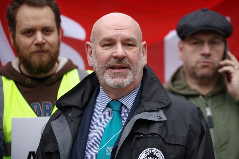 &copy; Reuters. FILE PHOTO: General Secretary of ASLEF Mick Whelan poses with other union members at a picket line outside Euston station while on strike, in London, Britain, January 5, 2023. REUTERS/Henry Nicholls/File Photo