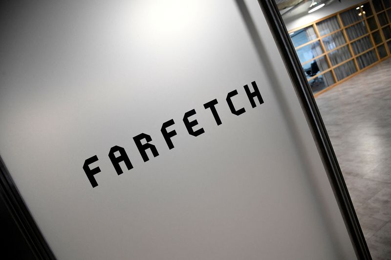 © Reuters. FILE PHOTO: Branding for online fashion house Farfetch is seen at the company headquarters in London, Britain January 31, 2018. REUTERS/Toby Melville