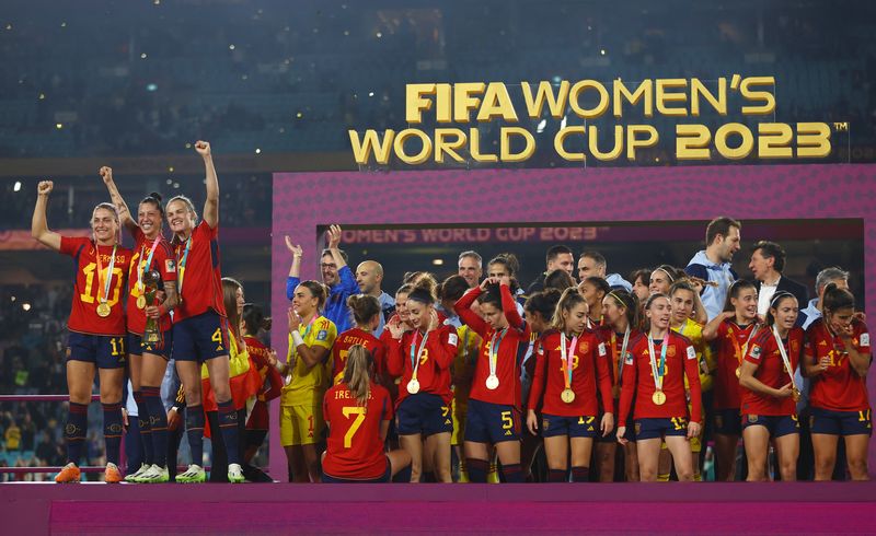 &copy; Reuters. Soccer Football - FIFA Women's World Cup Australia and New Zealand 2023 - Final - Spain v England - Stadium Australia, Sydney, Australia - August 20, 2023 Spain players celebrate with the trophy after winning the World Cup REUTERS/Carl Recine