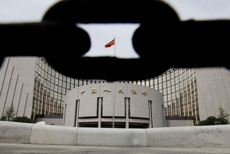 &copy; Reuters. FILE PHOTO: The headquarters of the People's Bank of China, the central bank, is pictured behind an iron chain in Beijing August 30, 2010. REUTERS/Jason Lee/File Photo