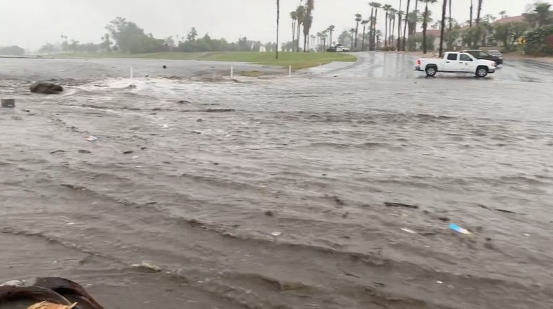 &copy; Reuters. A view shows flood water moving across the road during Tropical Storm Hilary, in Palm Springs, California, U.S. August 20, 2023, in this screengrab from a social media video. Palm Springs Fire Department/Handout via REUTERS