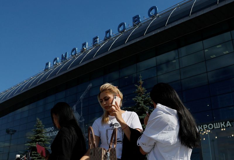 © Reuters. People stand in front of a terminal of the Domodedovo airport outside Moscow, Russia August 21, 2023. REUTERS/Maxim Shemetov
