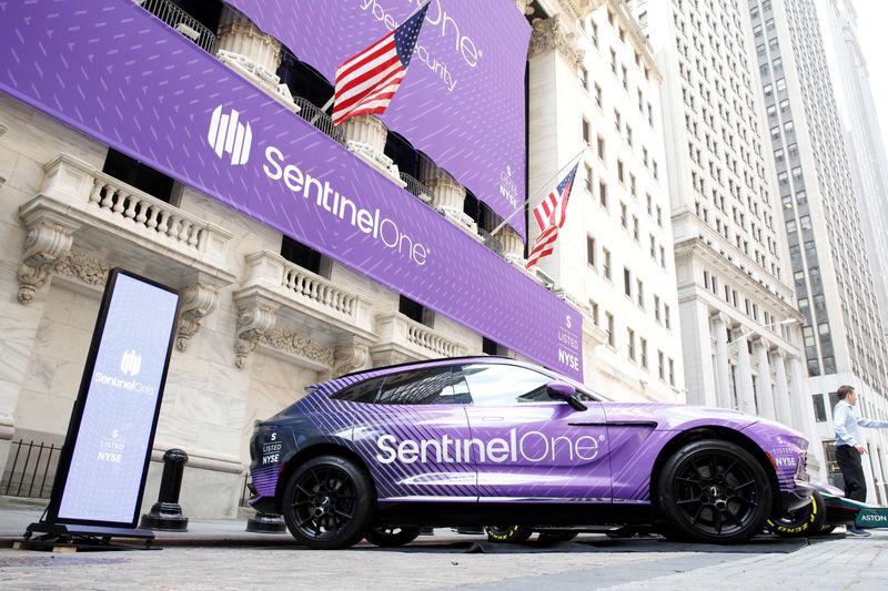 &copy; Reuters. Signage and cars are displayed in honor of SentinelOne, a cybersecurity firm’s IPO, outside the New York Stock Exchange (NYSE) in New York City, U.S., June 30, 2021.  REUTERS/Brendan McDermid/file photo