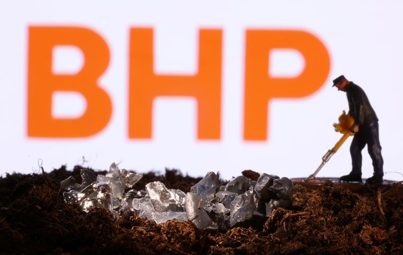 &copy; Reuters. A small toy figure and mineral imitation are seen in front of the BHP logo in this illustration taken November 19, 2021. REUTERS/Dado Ruvic/Illustration/file photo