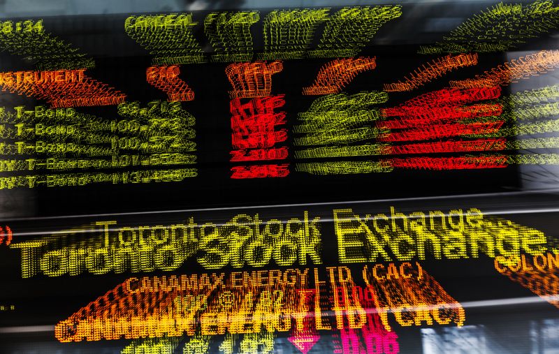 © Reuters. A sign board displaying Toronto Stock Exchange (TSX) stock information is seen in Toronto June 23, 2014.   REUTERS/Mark Blinch/file photo