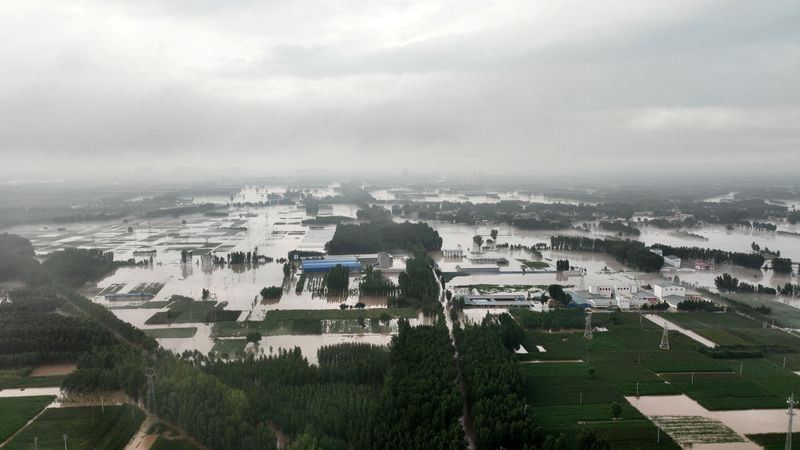 &copy; Reuters. Terres agricoles et maisons inondées près du village de Tazhao en Chine. /Photo prise le 1er août 2023/REUTERS/CBS photo