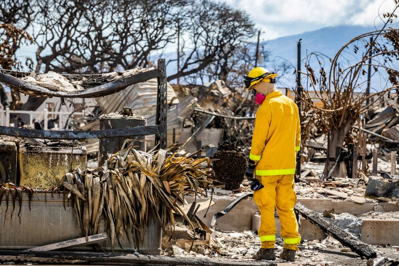 &copy; Reuters. A Combined Joint Task Force 50 (CJTF-50) search, rescue and recovery member conducts search operations of areas damaged by Maui wildfires in Lahaina, Hawaii, U.S. August 15, 2023.      U.S. Army National Guard/Staff Sgt. Matthew A. Foster/Handout via REUT