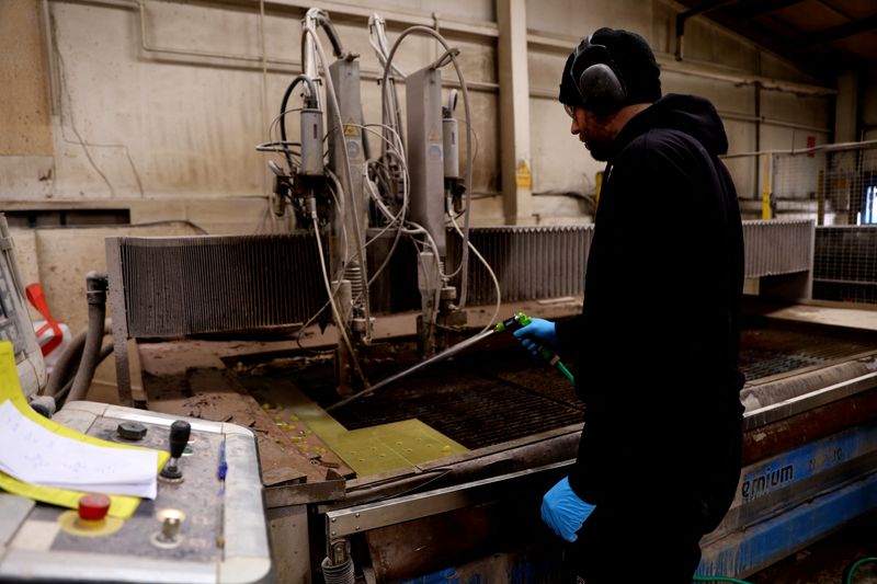 © Reuters. FILE PHOTO: A man works in the Farrat factory in Altrincham, Britain, May 12, 2023. REUTERS/Carl Recine/File Photo