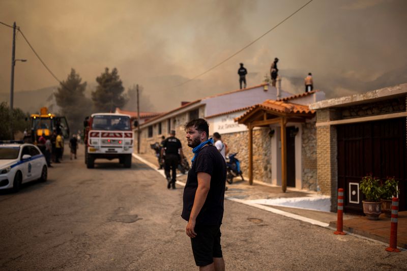 Scorched Europe battles deadly fires, Turkey shuts shipping lane