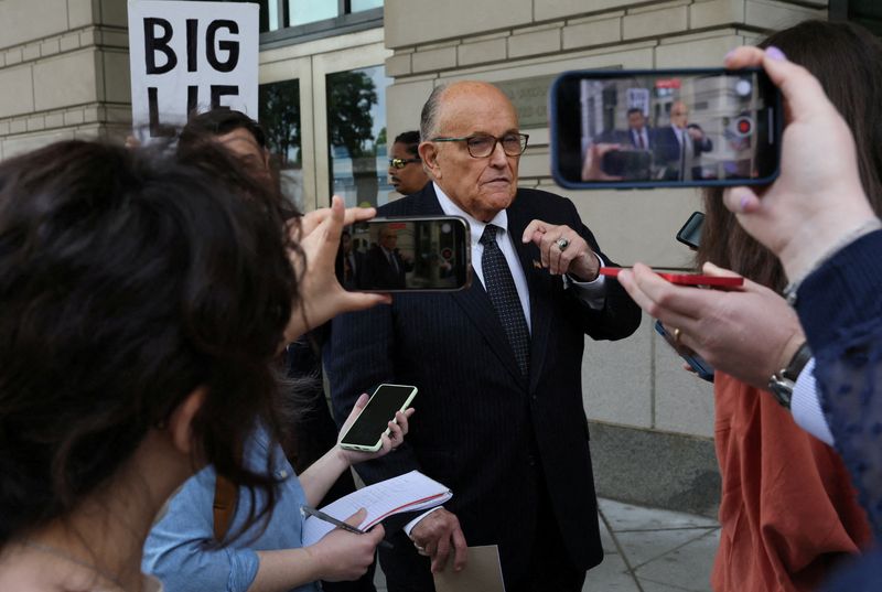 Giuliani heads to Georgia as others surrender in Trump election subversion case