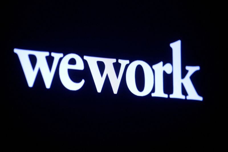 &copy; Reuters. FILE PHOTO: The WeWork logo is displayed on a screen during the company's IPO on the floor of the New York Stock Exchange (NYSE) in New York City, U.S., October 21, 2021.  REUTERS/Brendan McDermid/File Photo