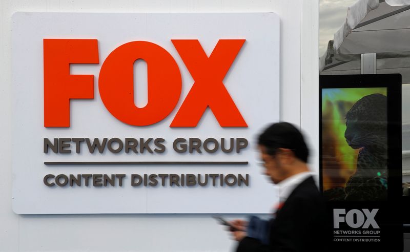 &copy; Reuters. A man walks past the logo of Fox Networks Group during the annual MIPCOM television programme market in Cannes, France, October 16, 2018. REUTERS/Eric Gaillard/file photo