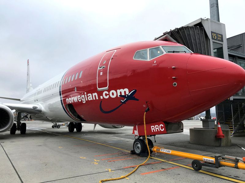 &copy; Reuters. FILE PHOTO: A Norwegian Air plane is refuelled at Oslo Gardermoen airport, Norway November 7, 2019.REUTERS/Lefteris Karagiannopoulos/File Photo