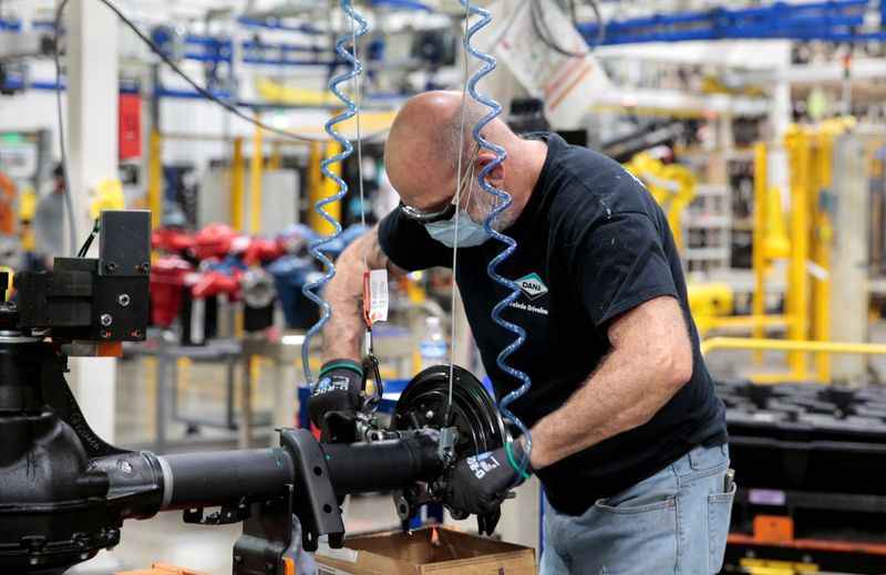 &copy; Reuters. FILE PHOTO: A Dana Inc. assembly technician wears a face mask as he assembles axles for automakers, as the auto industry begins reopening amid the coronavirus disease (COVID-19) outbreak, at the Dana plant in Toledo, Ohio,U.S., May 18, 2020. REUTERS/Rebec