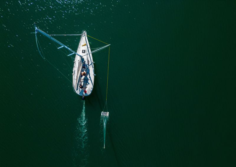 &copy; Reuters. A boat of NGO Oceaneye collects plastic fragments in the water of Lake Leman in Founex near Geneva, Switzerland August 21, 2023.  REUTERS/Denis Balibouse