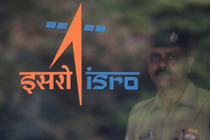 &copy; Reuters. FILE PHOTO: A security guard stands behind the logo of Indian Space Research Organisation (ISRO) at its headquarters in Bengaluru, India, June 12, 2019. REUTERS/Francis Mascarenhas//File Photo