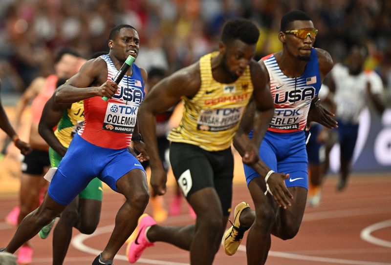 &copy; Reuters. Athletics - World Athletics Championship - Men's 4x100m Relay Heats - National Athletics Centre, Budapest, Hungary - August 25, 2023 Christian Coleman and Fred Kerley of the U.S. in action with Germany's Lucas Ansah-Peprah during heat 1 REUTERS/Dylan Mart